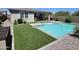 Stunning pool with artificial turf and landscaped backyard, creating a private oasis for homeowners to enjoy at 18871 S 209Th Way, Queen Creek, AZ 85142