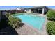 Inviting swimming pool, enhanced landscaping, and patio area, perfect for relaxing and enjoying the outdoors at 18871 S 209Th Way, Queen Creek, AZ 85142