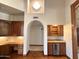 Convenient bar area with custom cabinetry, a wine cooler, and a built-in desk at 1905 N Calle Maderas --, Mesa, AZ 85213