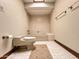 Cozy bathroom featuring tiled flooring, a bathtub, and neutral decor at 1905 N Calle Maderas --, Mesa, AZ 85213