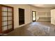 Clean garage space with ample storage, a work bench, and access to the backyard at 1905 N Calle Maderas --, Mesa, AZ 85213
