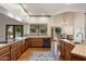 Open kitchen with hardwood floors, stainless steel appliances, and a view to the pool at 1905 N Calle Maderas --, Mesa, AZ 85213