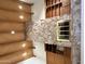 Unique interior showcasing a stone accent wall, wooden shelving, and a wood plank ceiling at 1905 N Calle Maderas --, Mesa, AZ 85213