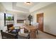 Cozy home office with a wooden desk, comfortable seating, and a bright window view at 1905 N Calle Maderas --, Mesa, AZ 85213