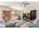 Comfortable living room with neutral colors, large windows, and hardwood floors at 19771 W Woodlands Ave, Buckeye, AZ 85326