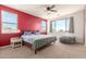 Comfortable main bedroom featuring a plush beanbag chair, soft carpet, and ample natural light from the windows at 19771 W Woodlands Ave, Buckeye, AZ 85326