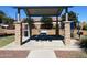 Covered community pavilion with picnic tables and a grill, ideal for outdoor gatherings and relaxation at 19771 W Woodlands Ave, Buckeye, AZ 85326