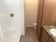 Updated bathroom featuring a shower with white tile and granite countertops at 2206 S Ellsworth Rd # 1736, Mesa, AZ 85209