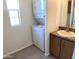 Convenient bathroom with stacked washer and dryer, and vanity with countertop at 2206 S Ellsworth Rd # 1736, Mesa, AZ 85209