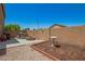 A charming backyard featuring a firepit, barbecue and ample patio area at 22610 W Mohave St, Buckeye, AZ 85326