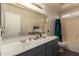 The bathroom features a shower over bath and a generous vanity top at 22610 W Mohave St, Buckeye, AZ 85326
