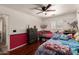 This bedroom features two beds and a ceiling fan, offering comfort and style at 22610 W Mohave St, Buckeye, AZ 85326