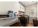 Laundry room featuring modern washer and dryer with ample storage at 22610 W Mohave St, Buckeye, AZ 85326