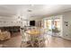 Open-concept room with sliding glass doors, features access to the backyard and plenty of space to eat at 22610 W Mohave St, Buckeye, AZ 85326