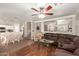 Open-concept living and dining area with hardwood floors, neutral walls, and lots of light at 22610 W Mohave St, Buckeye, AZ 85326