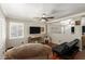 Comfortable living room boasts hardwood floors, natural light, and a ceiling fan at 22610 W Mohave St, Buckeye, AZ 85326