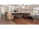 Inviting living room with hardwood floors, a large sofa, and a comfortable recliner at 22610 W Mohave St, Buckeye, AZ 85326