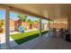 Spacious covered patio, ideal for outdoor entertaining with play structure at 22610 W Mohave St, Buckeye, AZ 85326