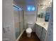Bathroom includes a glass shower, toilet, vanity with mirror and decorative lighting at 2290 S Seminole Dr, Apache Junction, AZ 85119