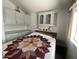 Bedroom with built-in cabinets and a colorful quilt on the bed at 2290 S Seminole Dr, Apache Junction, AZ 85119