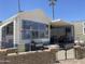 Exterior of a two-story home with a grill, covered porch and desert landscaping at 2290 S Seminole Dr, Apache Junction, AZ 85119
