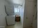 Practical laundry features a combined washer/dryer setup and utility sink maximizing space at 2290 S Seminole Dr, Apache Junction, AZ 85119