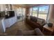 Open-concept space with living room, kitchen and access to the patio area at 2290 S Seminole Dr, Apache Junction, AZ 85119
