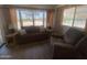 Inviting living room featuring comfortable seating and a large window with bright natural light at 2290 S Seminole Dr, Apache Junction, AZ 85119