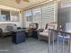 Enjoy the outdoors on this covered patio with comfortable seating and ceiling fan at 2290 S Seminole Dr, Apache Junction, AZ 85119