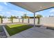 A covered patio opens to a modern backyard featuring a section of artificial turf and a gravel area at 2402 N 15Th St, Phoenix, AZ 85006