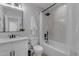 This bathroom offers a shower with marble tile and modern black fixtures, alongside a vanity at 2402 N 15Th St, Phoenix, AZ 85006