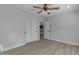 Bright bedroom features a ceiling fan, white walls, and a closet with sliding doors at 2402 N 15Th St, Phoenix, AZ 85006