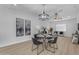 Dining area with modern lighting fixture, neutral color palette, and contemporary decor at 2402 N 15Th St, Phoenix, AZ 85006
