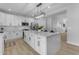 Kitchen with a large island, stainless appliances, and stylish modern lighting at 2402 N 15Th St, Phoenix, AZ 85006