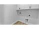 Functional laundry room with white cabinets and washer/dryer hookups, ready for appliances at 2402 N 15Th St, Phoenix, AZ 85006