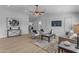 Bright living room with modern furniture, wood floors, ceiling fan, and large windows for natural light at 2402 N 15Th St, Phoenix, AZ 85006