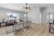 Open-concept living area with wood floors, neutral walls, modern furniture, and bright natural light at 2402 N 15Th St, Phoenix, AZ 85006