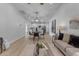Open-concept floor plan with living room, dining area, and kitchen, with wood flooring at 2402 N 15Th St, Phoenix, AZ 85006