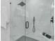 This glass shower has marble accents, a modern showerhead, and contemporary fixtures at 2402 N 15Th St, Phoenix, AZ 85006