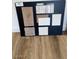 Sample board showing interior design options for flooring, countertop, and backsplash at 24236 W Southgate Ave, Buckeye, AZ 85326
