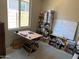 Versatile room with natural light, perfect as a home office, craft room, or creative space at 25657 N 185Th Dr, Surprise, AZ 85387