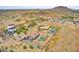 Stunning aerial view of desert homes, featuring a community pool and mountain views at 25927 N 149Th Dr, Surprise, AZ 85387