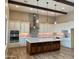 Gorgeous kitchen featuring custom cabinets, stainless steel appliances, and a large center island at 25927 N 149Th Dr, Surprise, AZ 85387