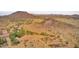 Expansive land in a desert landscape, close to the mountains with scattered trees at 25927 N 149Th Dr, Surprise, AZ 85387