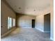 Spacious unfinished living room with large windows offering ample natural light at 25927 N 149Th Dr, Surprise, AZ 85387