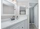 Bright bathroom with a white vanity, modern fixtures, and a shower with a gray curtain at 2615 N Hayden Rd # 114, Scottsdale, AZ 85257