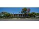 Exterior view of the complex, showcasing well-maintained landscaping and street access at 2615 N Hayden Rd # 114, Scottsdale, AZ 85257