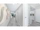 Hallway with white doors, gray walls, and modern art pieces at 2615 N Hayden Rd # 114, Scottsdale, AZ 85257