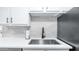 Kitchen sink features quartz countertops and a matte black faucet at 2615 N Hayden Rd # 114, Scottsdale, AZ 85257