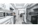 Bright kitchen features modern appliances, white cabinets and plenty of counter space at 2615 N Hayden Rd # 114, Scottsdale, AZ 85257